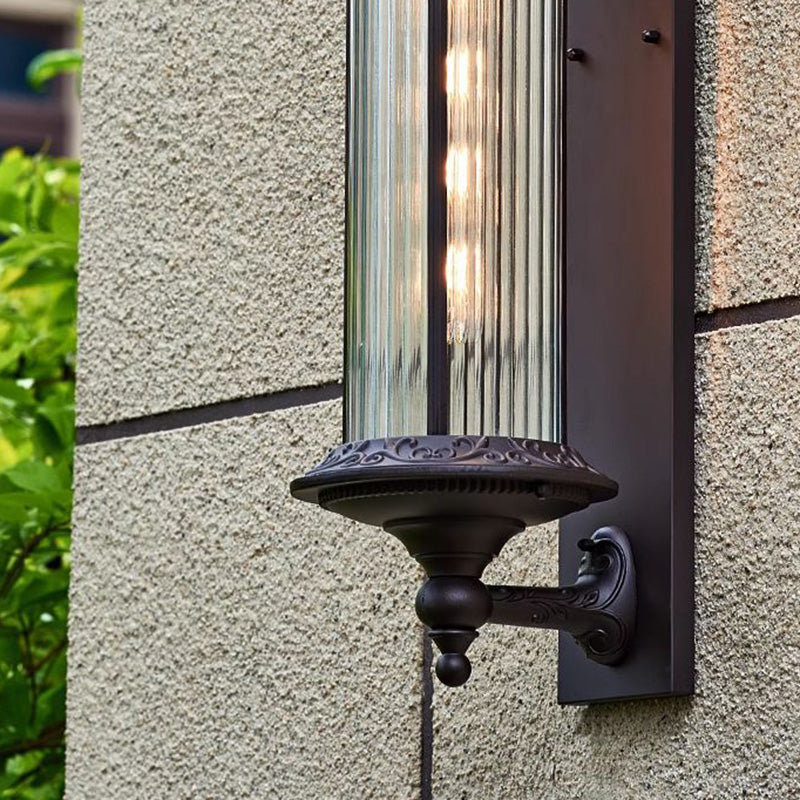 Lámpara de pared de 1 luz cilíndrica de vidrio y aluminio impermeable, estilo retro contemporáneo para jardín