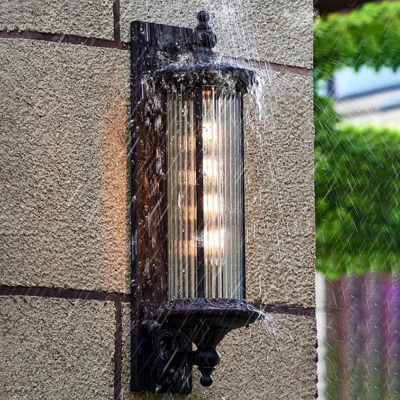 Lámpara de pared de 1 luz cilíndrica de vidrio y aluminio impermeable, estilo retro contemporáneo para jardín