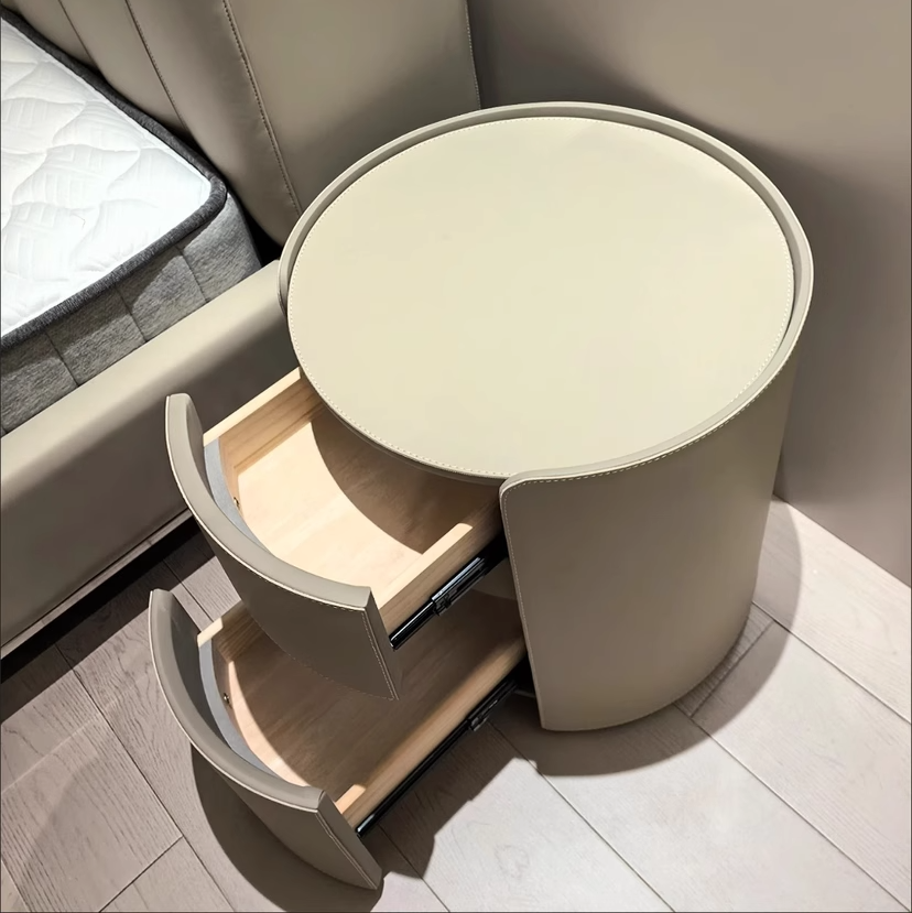 Mesita de noche moderna de lujo redonda de madera contrachapada con piel sintética y 2 cajones para dormitorio