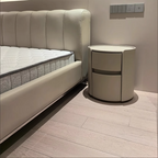 Mesita de noche moderna de lujo redonda de madera contrachapada con piel sintética y 2 cajones para dormitorio
