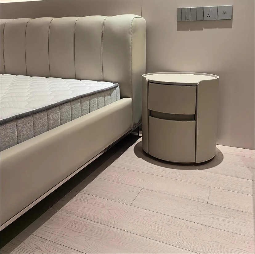Mesita de noche moderna de lujo redonda de madera contrachapada con piel sintética y 2 cajones para dormitorio
